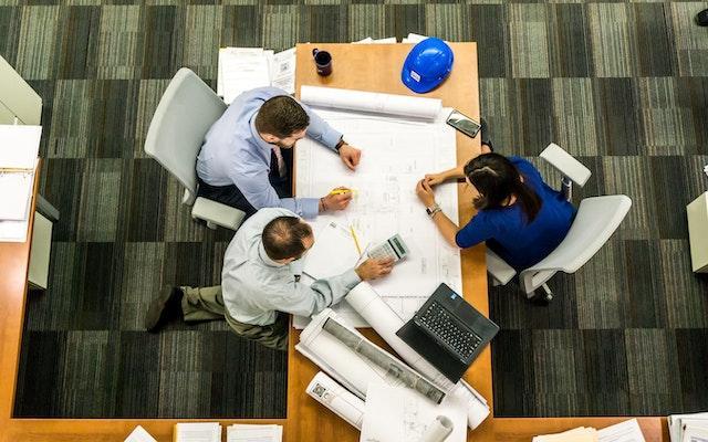 Architects and Builders Discussing Building Plans