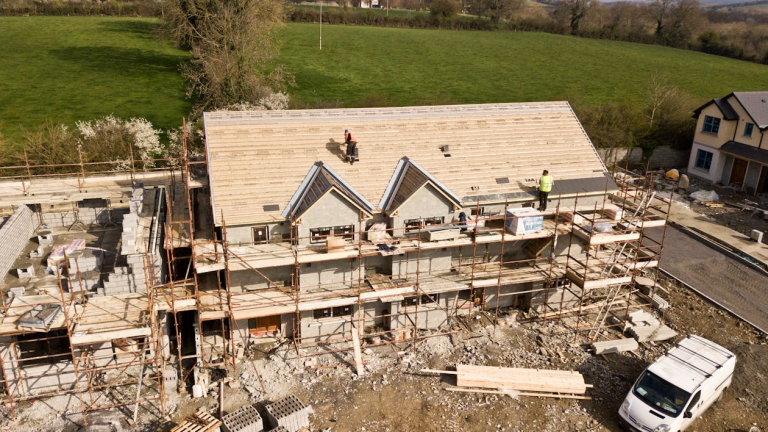 brown 3 story house construction