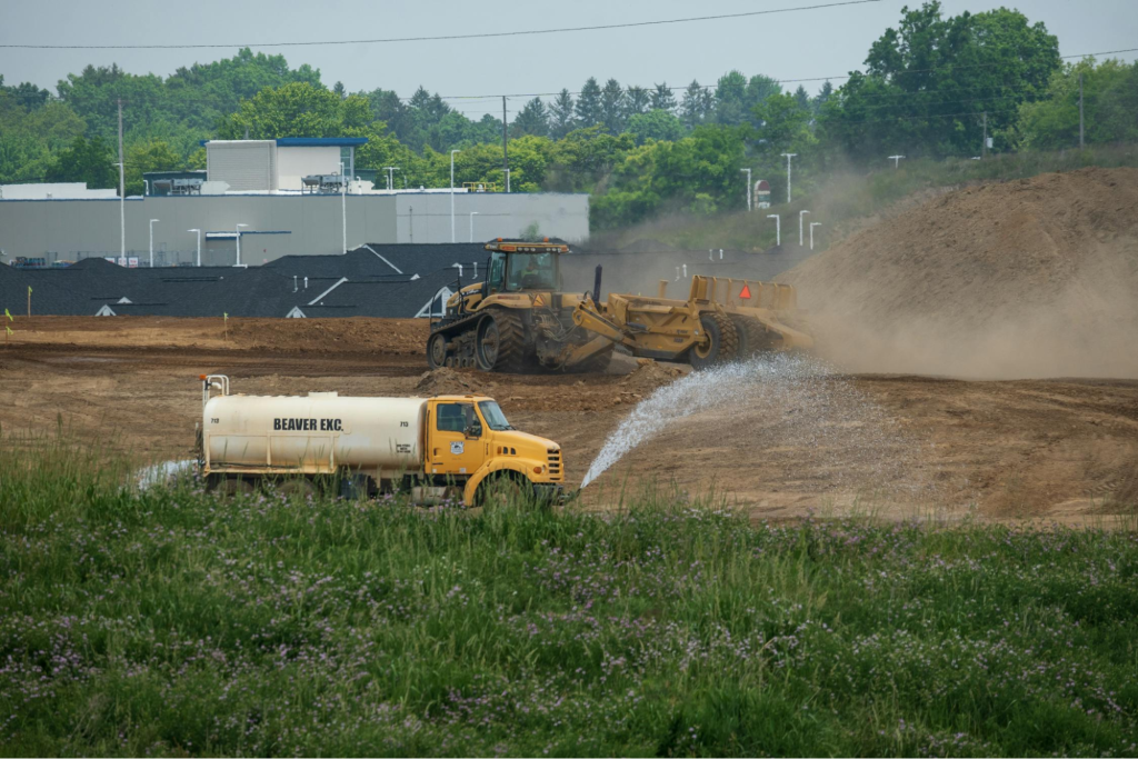 heavy machinery preparing the ground for building